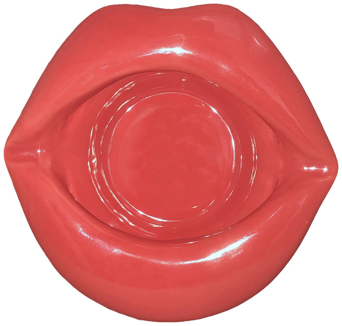 Sexy Lips Ashtray from Kheper Games NV.015 Sexy Lips Ashtray. Hey Sexy! Show off your style with this vibrantly colored Sexy Red Lip Shaped Ashtray. Style meets function as you show off your sexiness while enjoying a smoke. Includes: a 5 inches wide