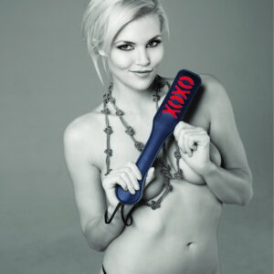 Sex and Mischief Collection XOXO Paddle Black. This black vinyl paddle features a red cheeky XOXO design that leaves a sexy impression on your partner! Details black vinyl paddle with XOXO design. Leaves a great impression! Black on red. Materials: Nickel