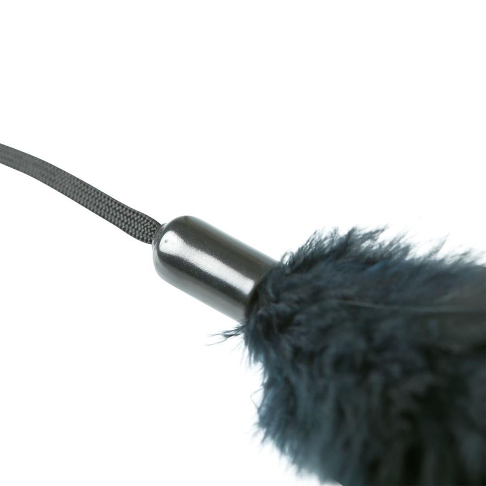 Pleasure Feathers Black. A perfect finishing touch to any sex toy collection! This sassy little feather tickler lets you arouse your lover with playful strokes across their body. Simply slide on the attached wrist strap